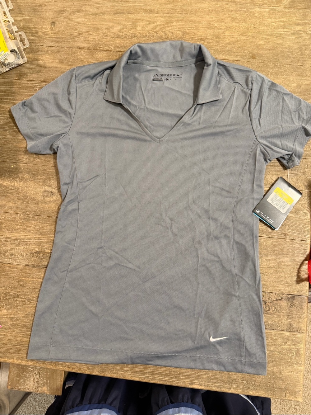 Nike Women’s Short-Sleeve V-Neck Performance Polo in Light Gray